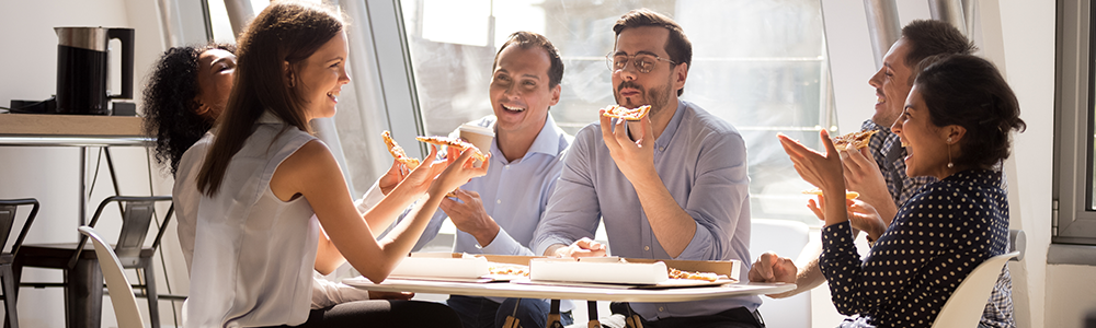 people eating pizza they received from an insulated delivery bag